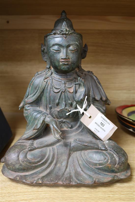 A Chinese bronze seated figure of a Buddha 29cm